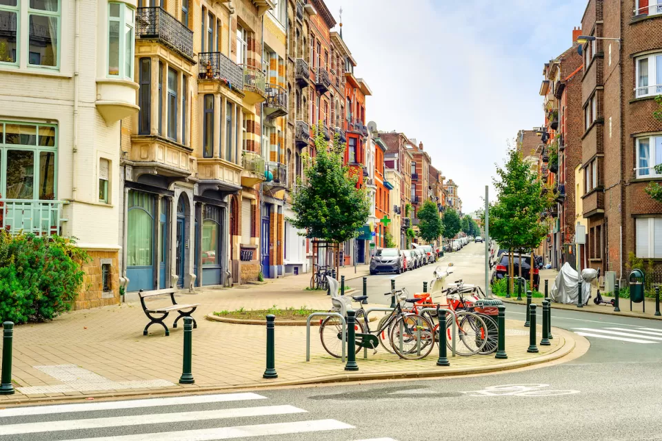 Streetscape in old neighborhood of Brussels, Belgium with bikes parked in bulb-out.
